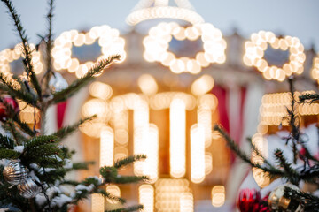Unfocus background of the carousel at the New Year's Fair. Beautifully blurred Christmas background