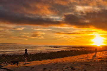 Fototapeta na wymiar Passing winter storm at sunset on the beach in Montecito California