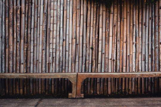 Old bamboo wall on natural light background. © Siwapot Narukietmont