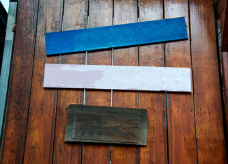 Three small wooden board signs