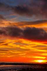 Fototapeta premium Passing winter storm at sunset on the beach in Montecito California