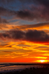 Fototapeta premium Passing winter storm at sunset on the beach in Montecito California
