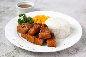 Freshly cooked crispy fried pork belly served with rice