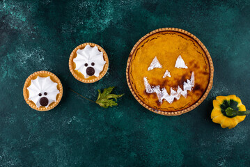 Halloween pumpkin pie in shape of jack-o-lantern