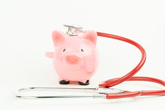 a piggy bank, a heart, and a stethoscope