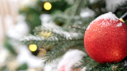 Decorated Christmas tree. Close-up of branches and decorative elements. Christmas green background.