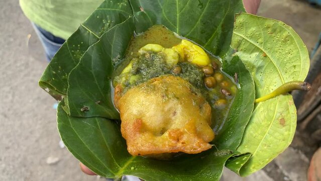 Dhooska or Dhuska or Dushka is a popular deep fried snack eaten all over Jharkhand served in a sal leaf. 