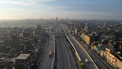 An aerial image of the Aazadi Chowk Interchange, located near the old city which includes historical landmarks of Lahore Fort and the famous Badshahi Mosque.