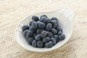 Sweet ripe blueberry heap in the bowl