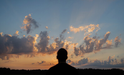 Obraz premium Man relax watching the sunset harmony with nature