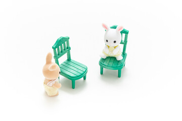 Miniature dollhouse furniture isolated on white background. Rabbit doll. Kids toy. Play and learn. Kids room. Childhood. Kindergarten toy. Developmental toys.
