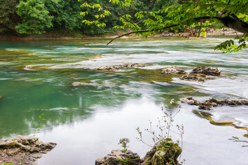 beautiful landscape with a mountain river on a summer day, shot on a long exposure