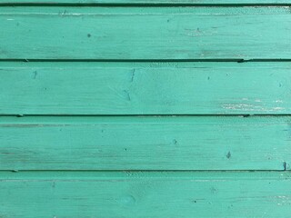 Fototapeta premium a light green painted washed out plank wall