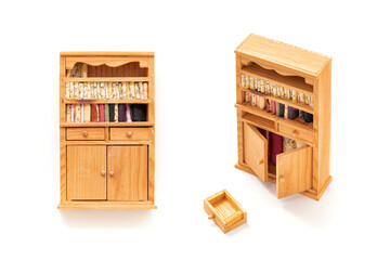 Wooden storage cabinet isolated on white background. Wooden toys. Kids toy. Miniature toy. Developmental toys. Kids room. Home decorative.

