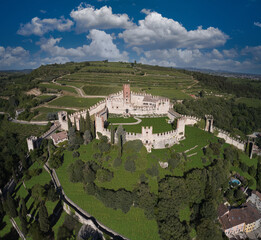 Soave castle aerial view Verona province, Italy. Ancient castle on a hill in Italy. View of Soave castle surrounded by vineyard plantations.
