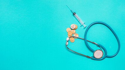 Syringe with vaccine on blue background from above