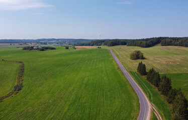 Aerial view of agro rural fields. Harvesting on the farm landscape