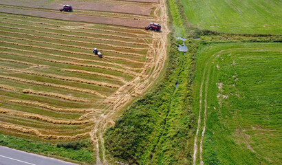 Aerial view of agro rural fields. Harvesting on the farm landscape