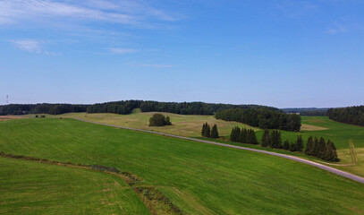 Aerial view of agro rural fields. Harvesting on the farm landscape