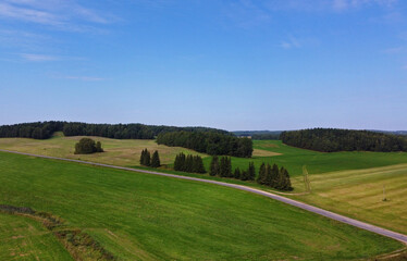 Obraz premium Aerial view of agro rural fields. Harvesting on the farm landscape