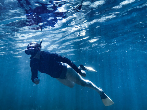 Woman snorkelling underwater in ocean
