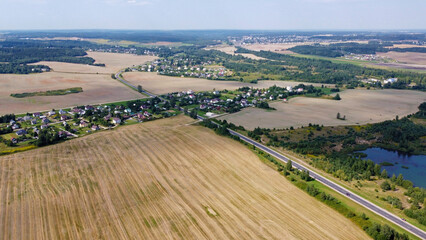 Aerial view of agro rural fields. Harvesting on the farm landscape