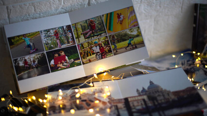 travel photo books lie near the Christmas tree