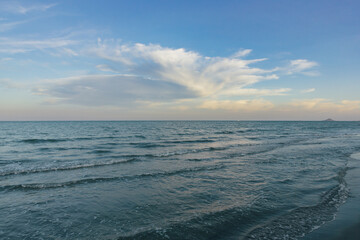 View of the sea and cloudy sky in the evening.