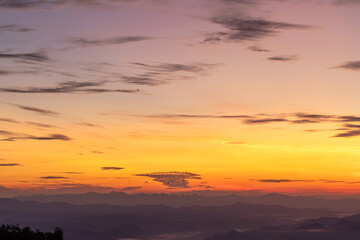 Sunset or sunrise mountain peaks colorful sky. Colorful Sky At Sunset Dawn Sunrise. Sun Over Skyline, Horizon. Warm Colours.