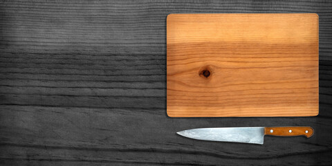 Topview of Cooking Knife and Cutting Board on Dark Background