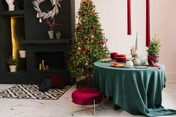 Festive dining room in Christmas decorations. Christmas dining room. Beautiful Christmas decor in the loft style of home interior.