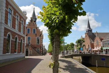 Foto auf Leinwand The historical center of Balk, Friesland, Netherlands, with historic houses, canals, the Raadhuis (former town hall on the left) and Breahus church (on the right) © Christophe Cappelli