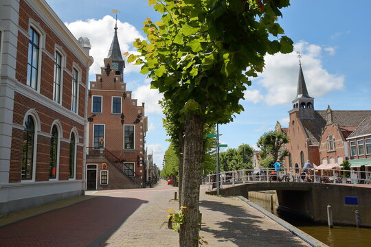 The historical center of Balk, Friesland, Netherlands, with historic houses, canals, the Raadhuis (former town hall on the left) and Breahus church (on the right)