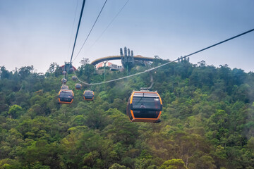 Cable cabs are running on high wire at Bana Hills in Danang, Vietnam. Bana Hills is interesting tourist new places to visit in Da Nang city, Vietnam