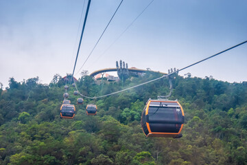 Cable cabs are running on high wire at Bana Hills in Danang, Vietnam. Bana Hills is interesting tourist new places to visit in Da Nang city, Vietnam