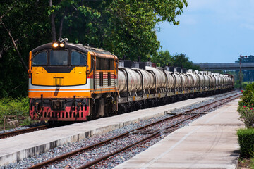 Tanker-freight train by diesel locomotive on the railway. 