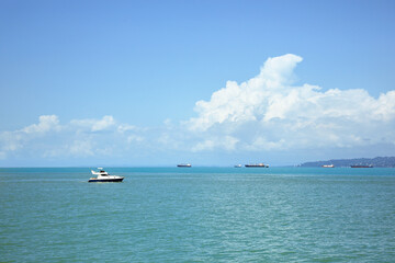 Fototapeta na wymiar Beautiful tranquil sea with boats on sunny summer day
