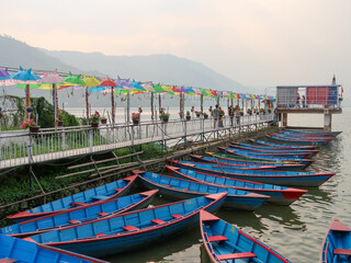Fototapeta na wymiar Boats for rent en Phewa Lake, Pokhara, Nepal