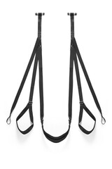 Detailed shot of a black fabric sex swing made out of durable fabric slings with soft plush pads. The adjustable accessory for erotic games is located on the white background.