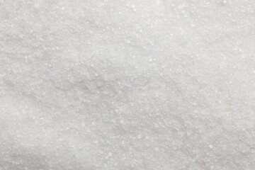 Sweet granulated sugar as background, top view