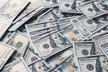 Dollar banknotes as background, closeup view. Money exchange