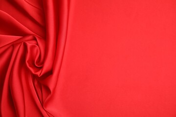 Texture of delicate red silk as background, top view