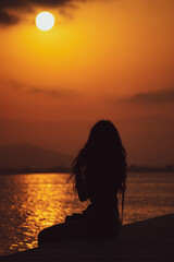 Sunset in Deltebre. Woman silhouette.