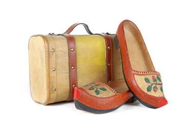 wooden shoe with an antique suitcase  isolé sur fond blanc 