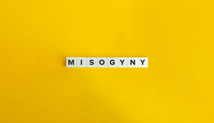 Misogyny Word and Banner. Letter Tiles on Yellow Background. Minimal Aesthetics.