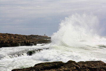 waves crashing on rocks