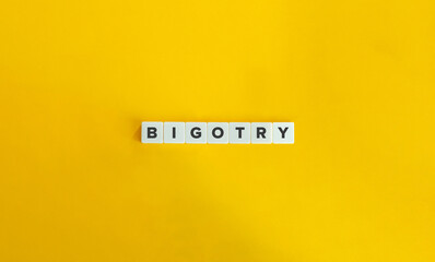 Bigotry Banner. Word on Letter Tiles on Yellow Background. Minimal Aesthetics.