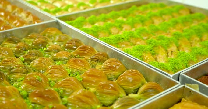 Image of mixed baklavas lined up on trays