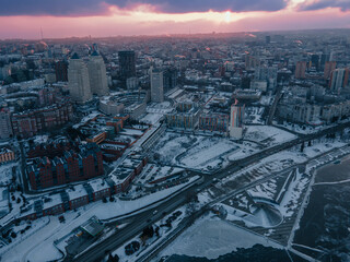 Naklejka na ściany i meble Dnipro, Ukraine. View of the central part of the city, the embankment of the Dnieper. Winter top view from a great height. Panoramic view of the city. Snow, cold.