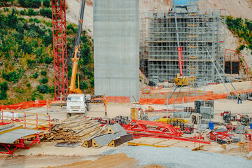  Constructing concrete pillars of the bridge. Construction of the new M12 highway